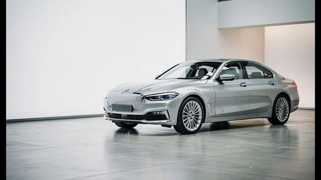 Premium car in neutral metallic finish displayed in elegant showroom lighting